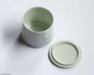 The inside of the sugar pot body and the back of the lid.