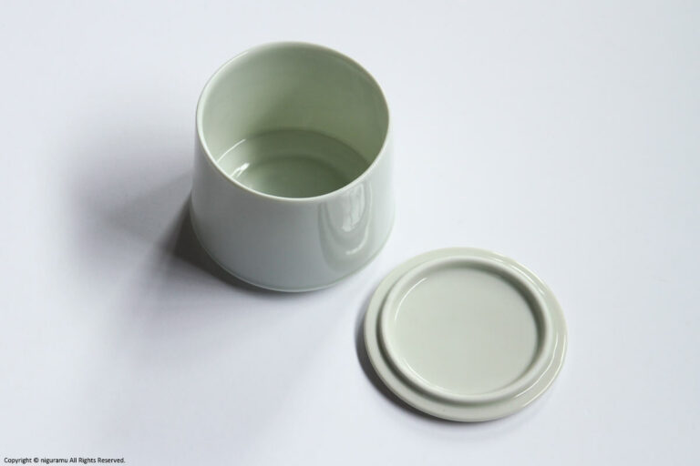 The inside of the sugar pot body and the back of the lid.