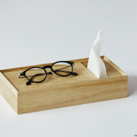 Place the glasses on the top tray of the tissue box.