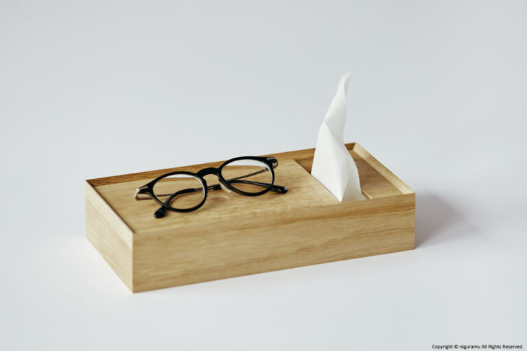 Place the glasses on the top tray of the tissue box.